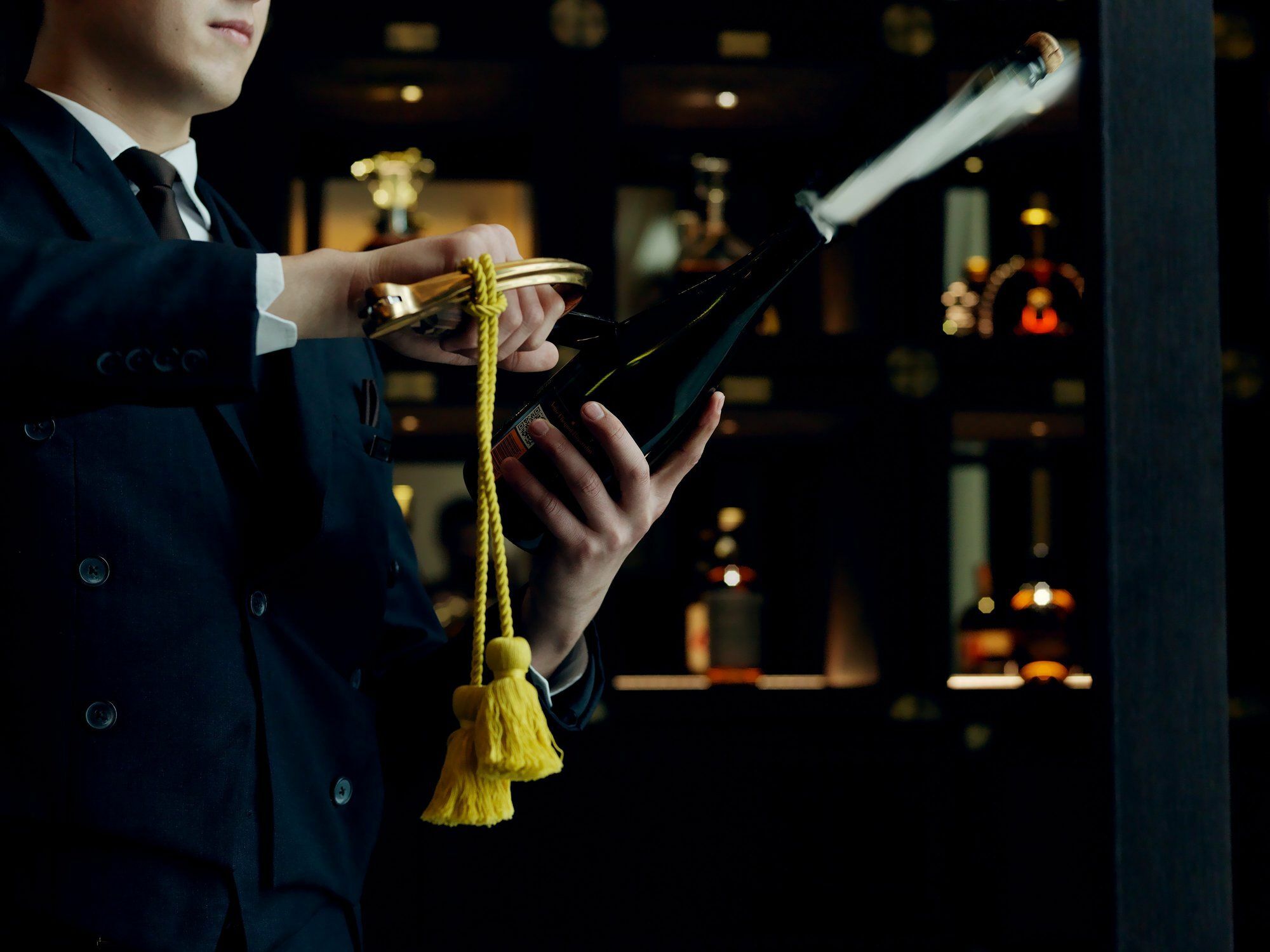The St. Regis Astana Ξενοδοχείο Εξωτερικό φωτογραφία A wine waiter opening a bottle of wine